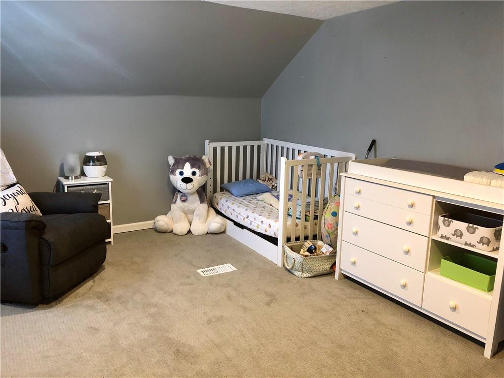 203 Lighthouse Road Commodore, PA 15729 - Photo 8 of 16 a bed room with a bed and a couch