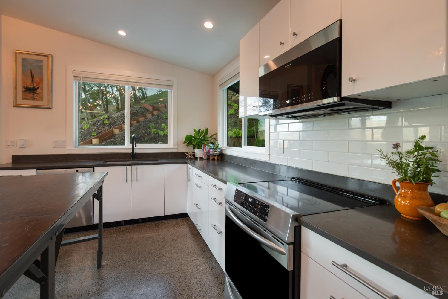 22855 Chianti Road Geyserville, CA 95411 - Photo 11 of 76 a kitchen with granite countertop a sink and a stove