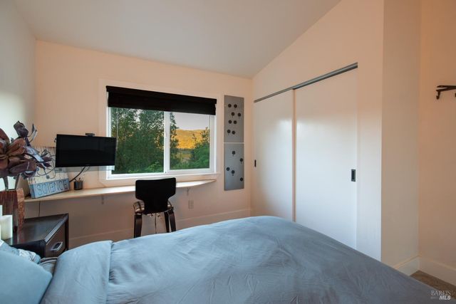 an aerial view of a house with a garden