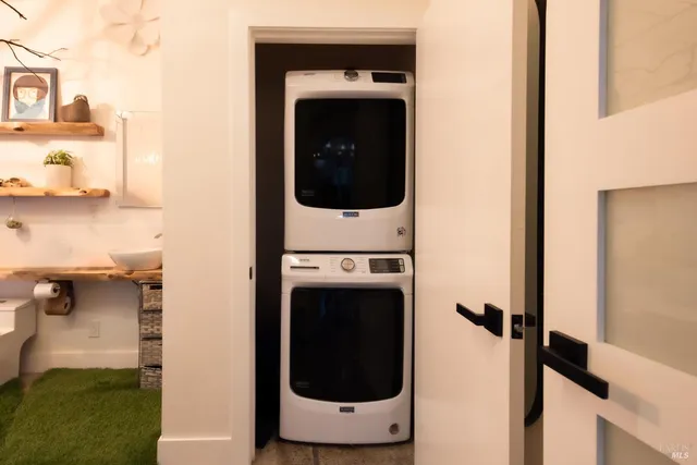 a living room with furniture a rug and a large window