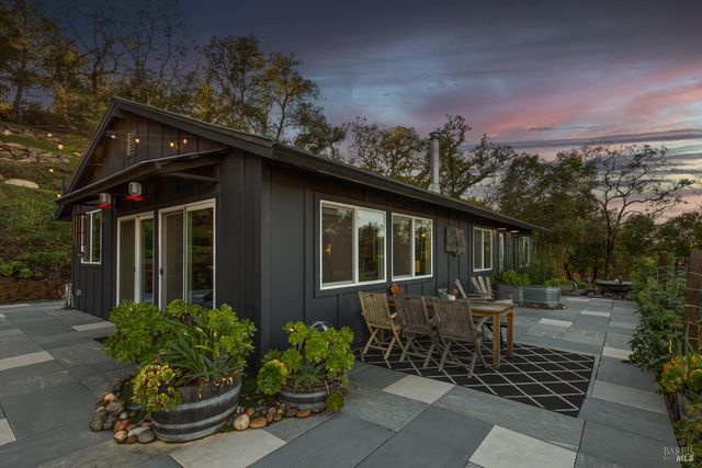a kitchen with a stove and a refrigerator
