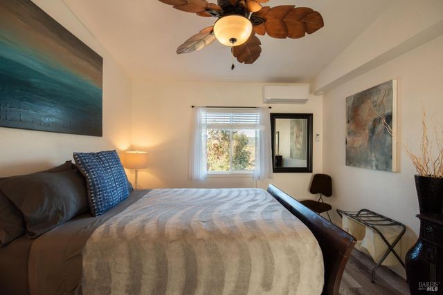a view of a chairs and table on the wooden floor
