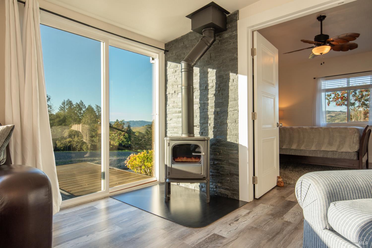 22855 Chianti Road Geyserville, CA 95411 - Photo 42 of 76 a living room with furniture and a large window