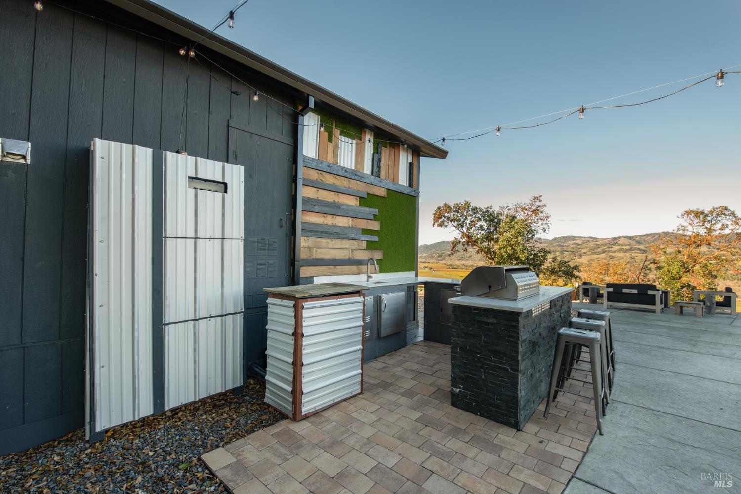 22855 Chianti Road Geyserville, CA 95411 - Photo 60 of 76 a kitchen with stainless steel appliances granite countertop a refrigerator and a stove