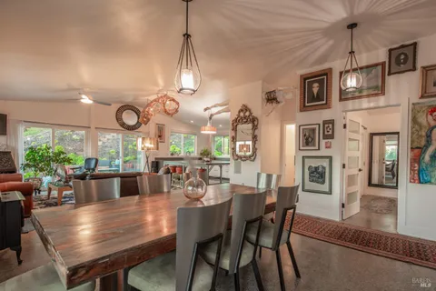 a kitchen with granite countertop a sink and a stove