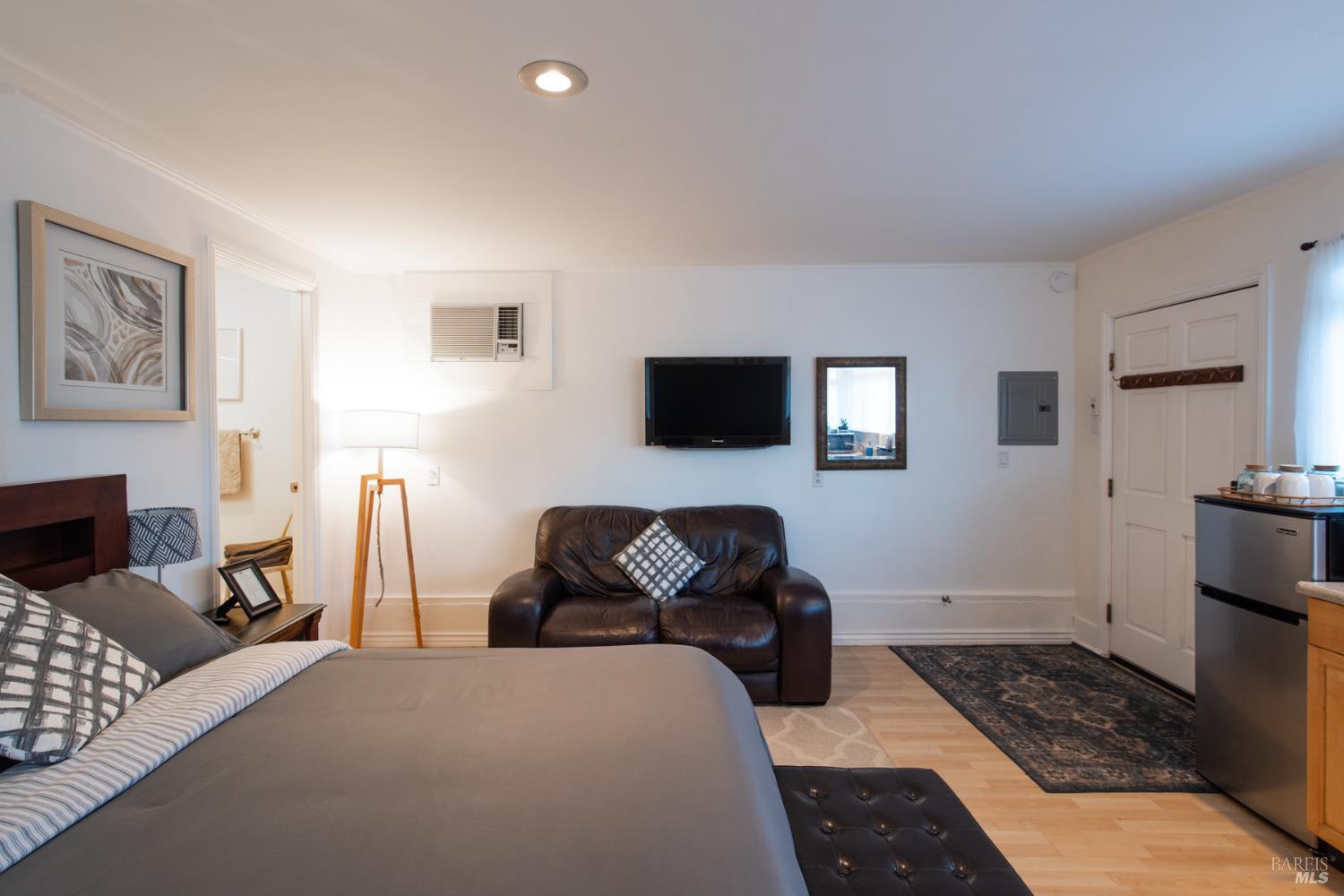 22855 Chianti Road Geyserville, CA 95411 - Photo 74 of 76 a bedroom with furniture and a flat screen tv