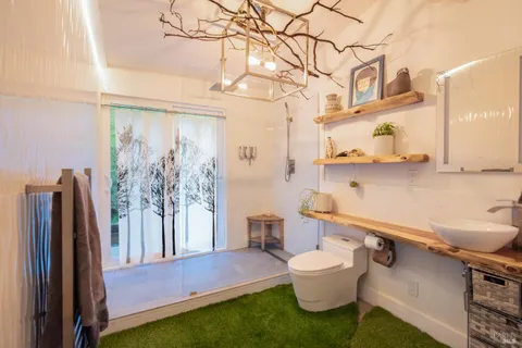 a bedroom with a bed and a large window