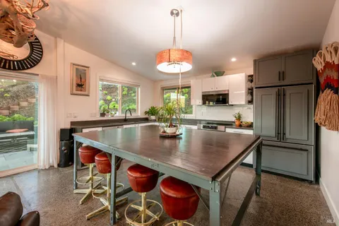 a bedroom with two beds and a large window