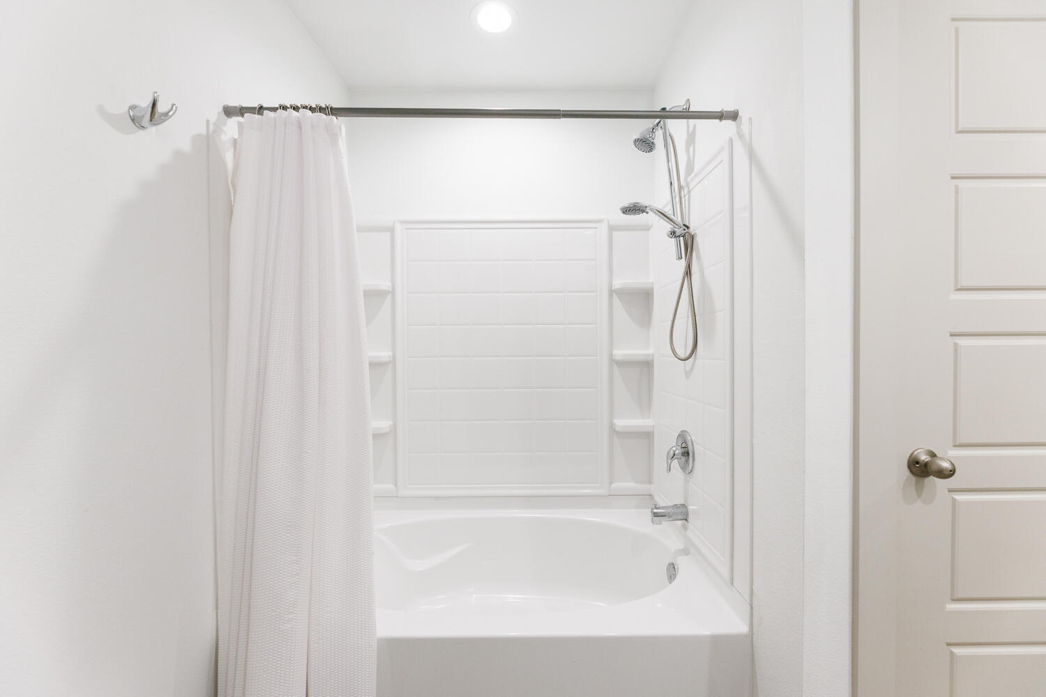 2305 150th Street Lubbock, TX 79423 - Photo 22 of 39 a bathroom with a shower and a bath tub