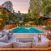 a view of a swimming pool with a lounge chairs