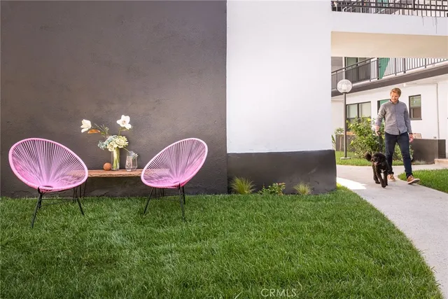 a room with gym equipment and wooden floor