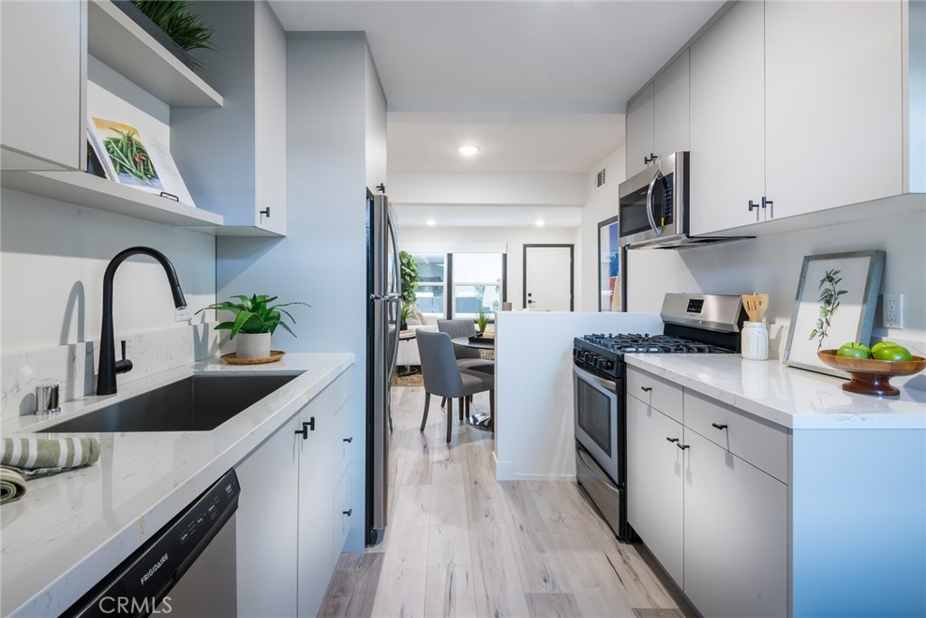 262 North Los Robles Avenue Pasadena, CA 91101 - Photo 25 of 45 a kitchen with cabinets a sink and appliances