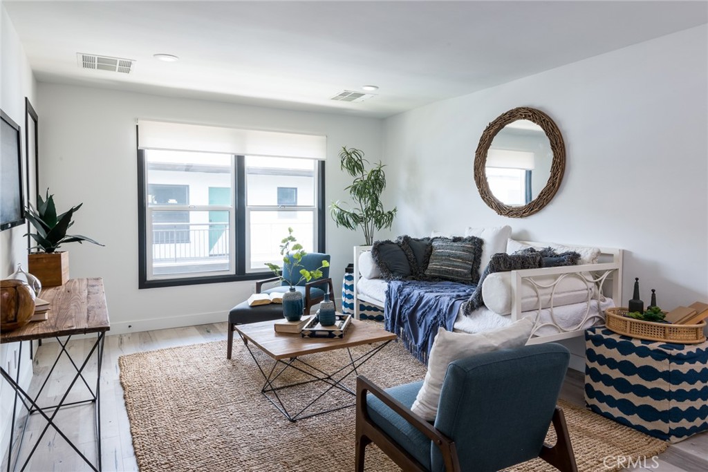 262 North Los Robles Avenue Pasadena, CA 91101 - Photo 27 of 45 a living room with furniture a window and a potted plant