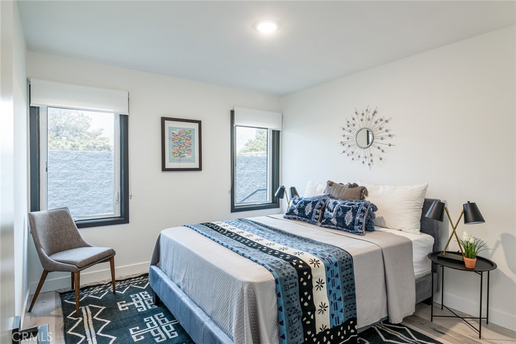 262 North Los Robles Avenue Pasadena, CA 91101 - Photo 30 of 45 a bedroom with a bed and wooden floor