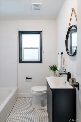 a view of storage and utility room with washer and dryer