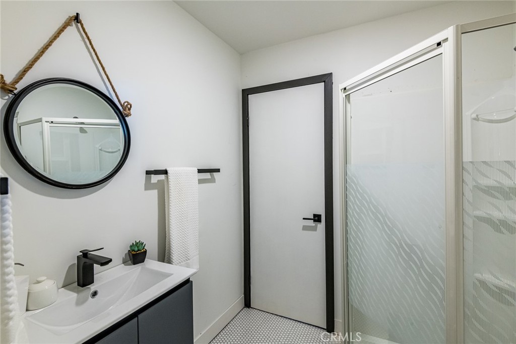 262 North Los Robles Avenue Pasadena, CA 91101 - Photo 38 of 45 a bathroom with a sink and a mirror