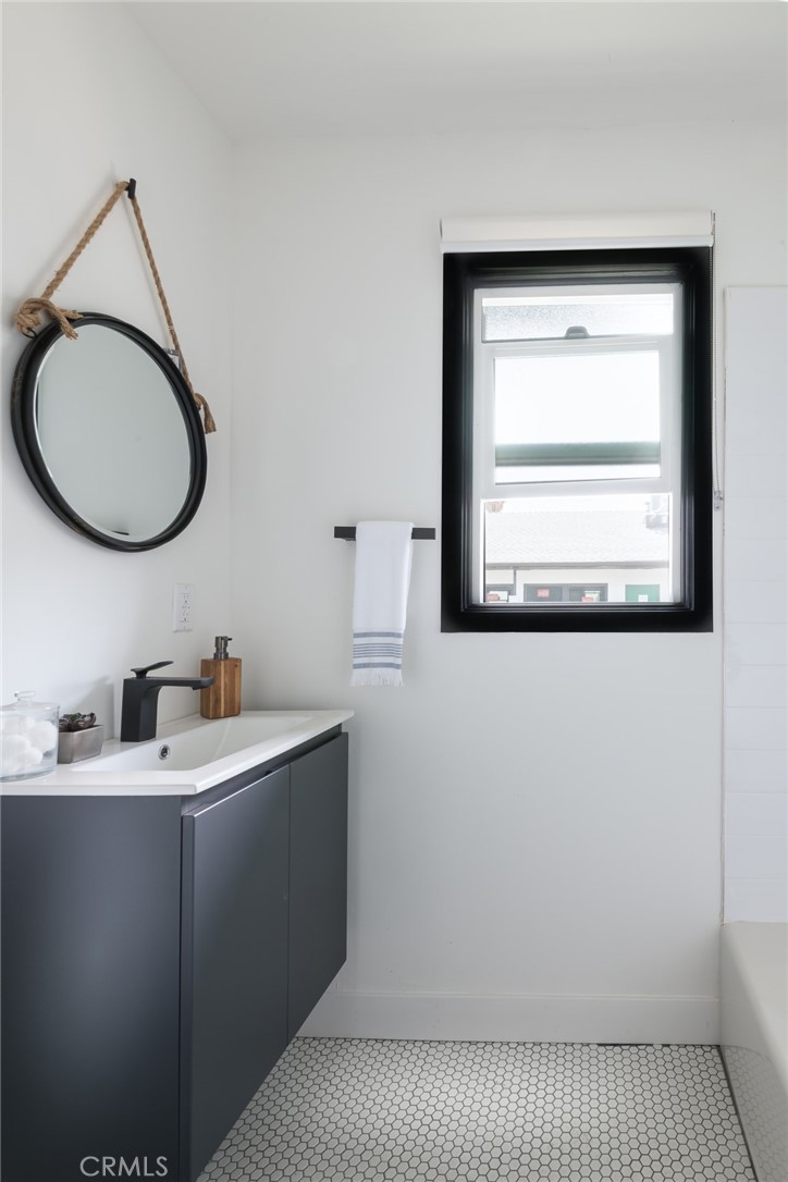 262 North Los Robles Avenue Pasadena, CA 91101 - Photo 42 of 45 a bathroom with a sink and a mirror