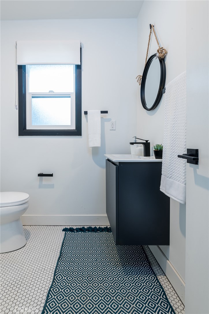 262 North Los Robles Avenue Pasadena, CA 91101 - Photo 43 of 45 a bathroom with a toilet sink and mirror