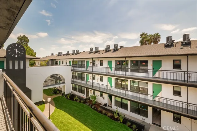 a balcony with a table and chairs