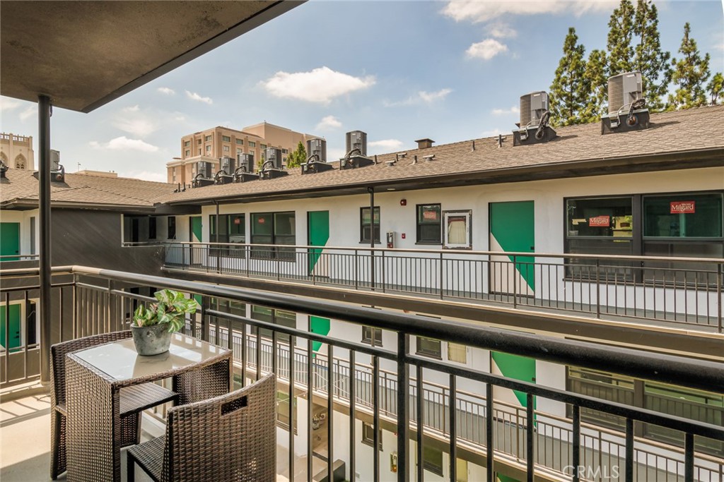262 North Los Robles Avenue Pasadena, CA 91101 - Photo 10 of 45 a balcony with a table and chairs