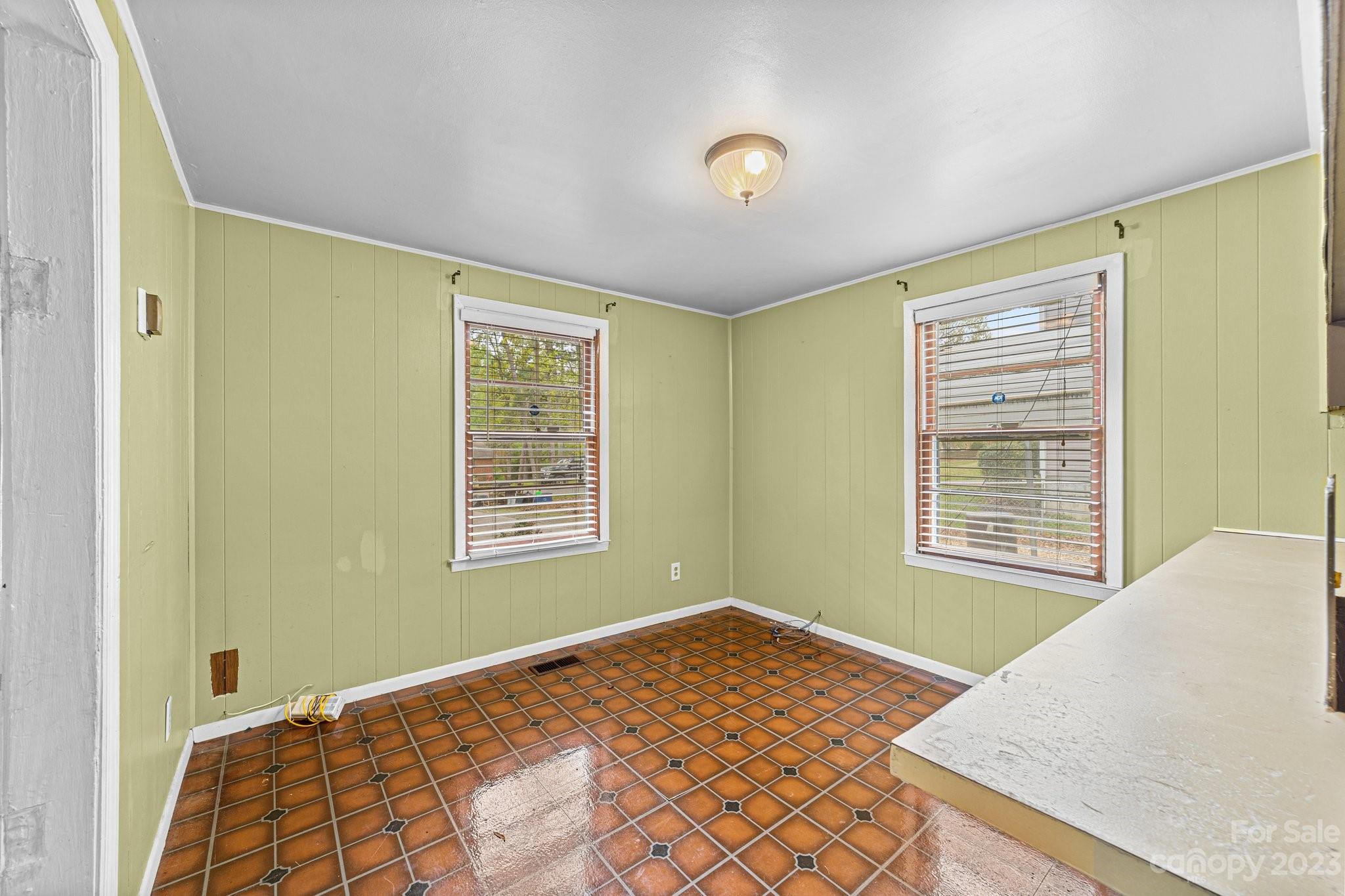 5641 Anderson Road Charlotte, NC 28269 - Photo 13 of 27 a bedroom with a bed and a window