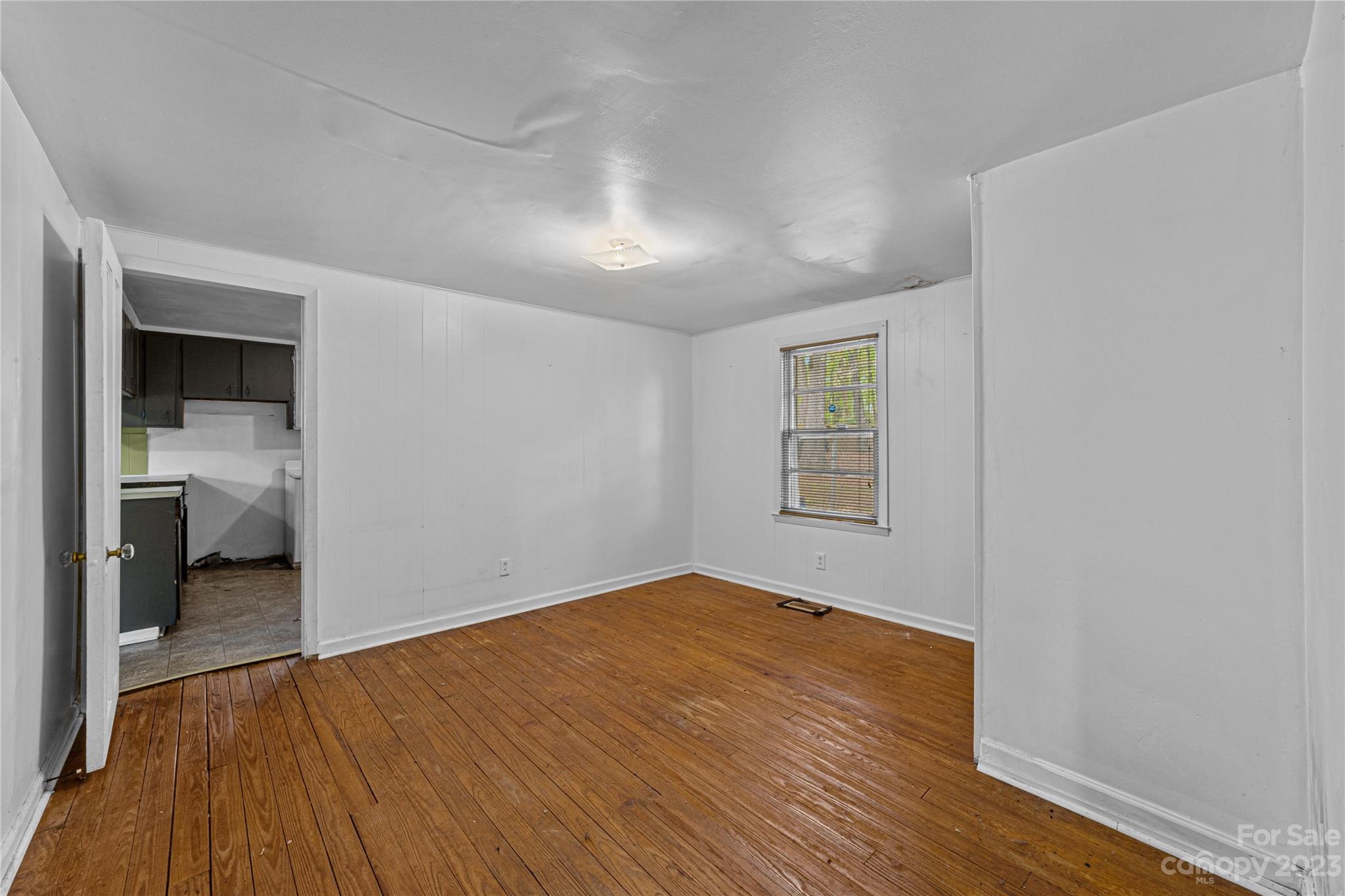 5641 Anderson Road Charlotte, NC 28269 - Photo 15 of 27 a view of a room with wooden floor