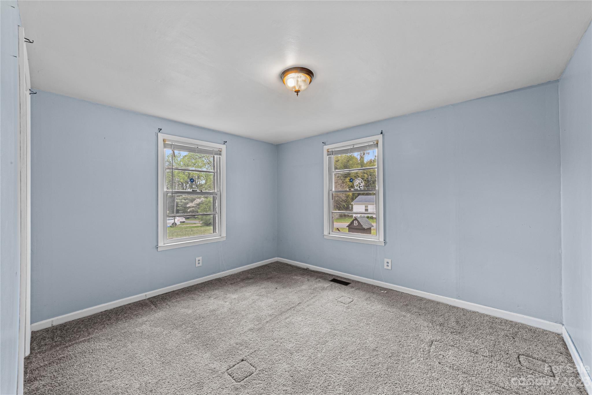 5641 Anderson Road Charlotte, NC 28269 - Photo 17 of 27 an empty room with windows