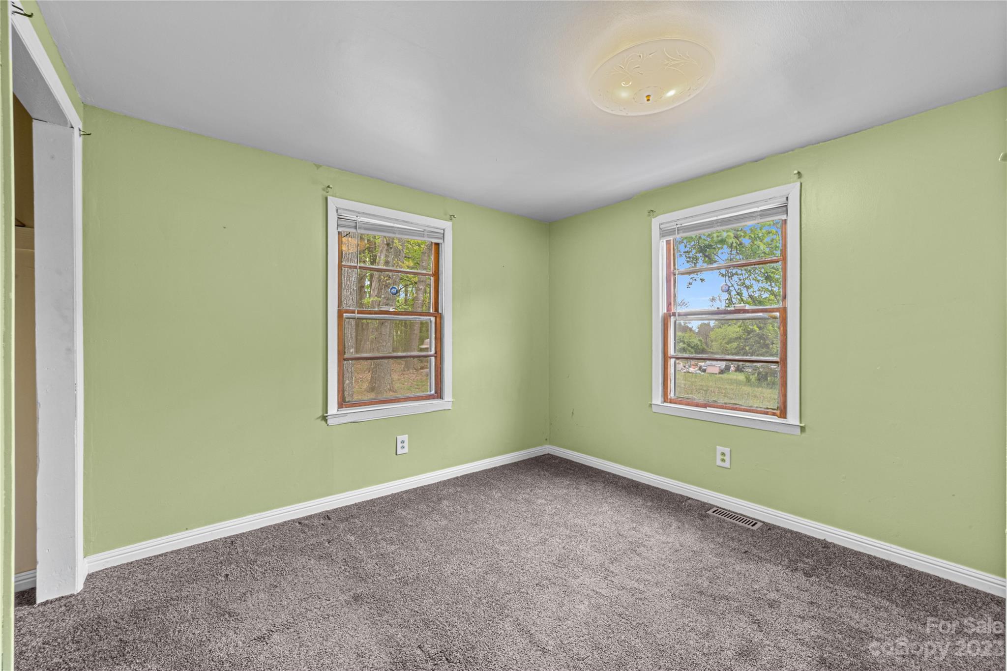 5641 Anderson Road Charlotte, NC 28269 - Photo 18 of 27 an empty room with a window