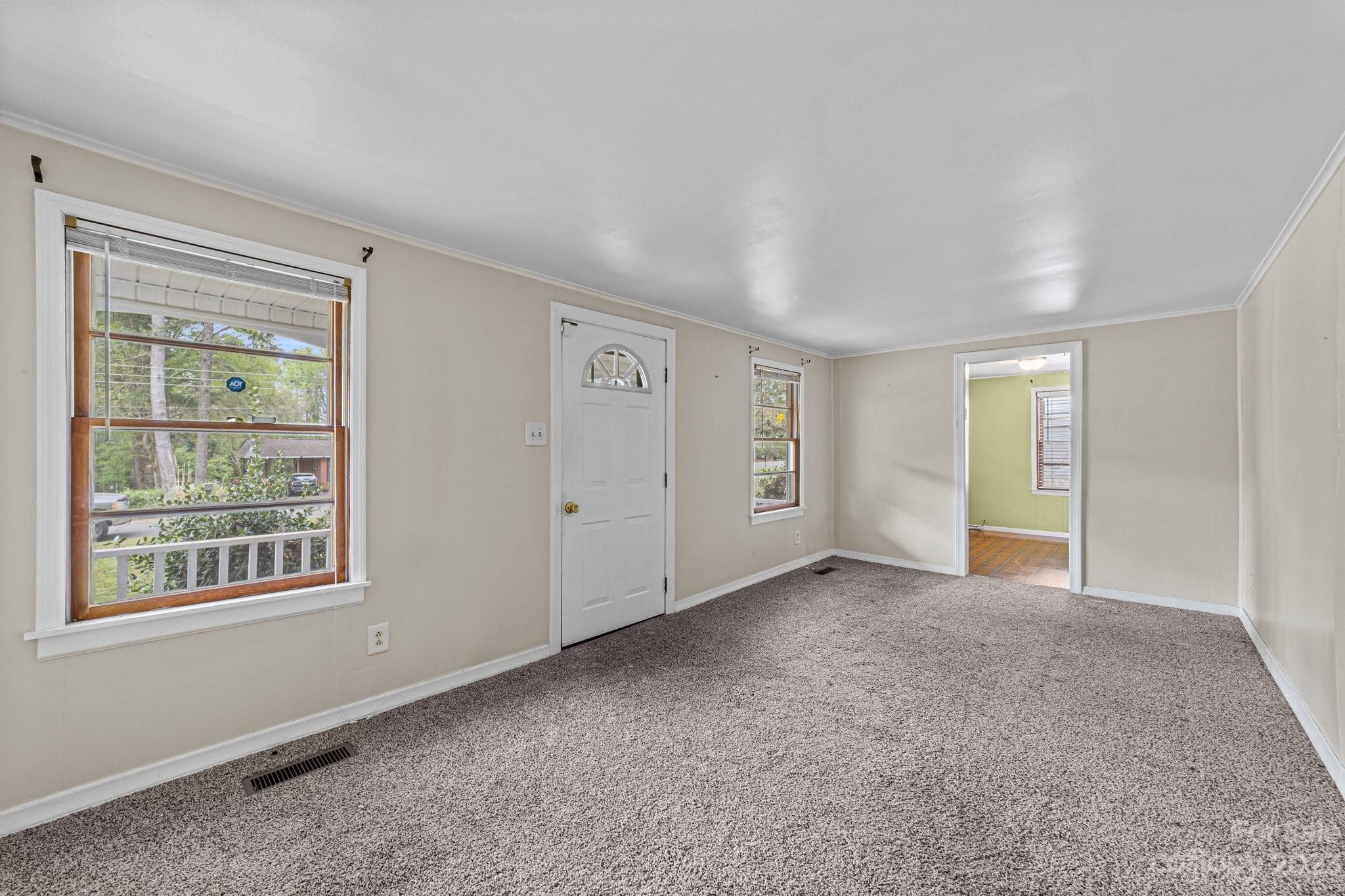 5641 Anderson Road Charlotte, NC 28269 - Photo 6 of 27 an empty room with windows