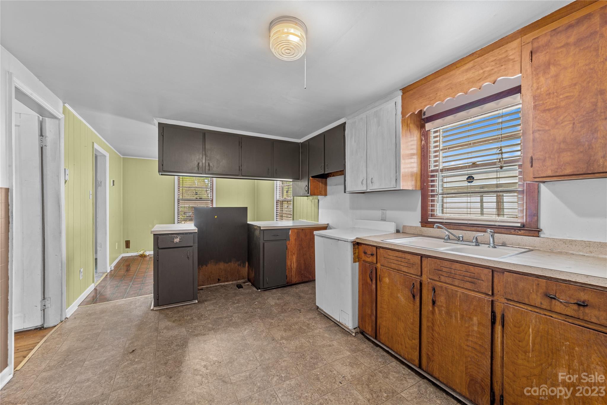 5641 Anderson Road Charlotte, NC 28269 - Photo 8 of 27 a kitchen with stainless steel appliances granite countertop a sink stove and refrigerator