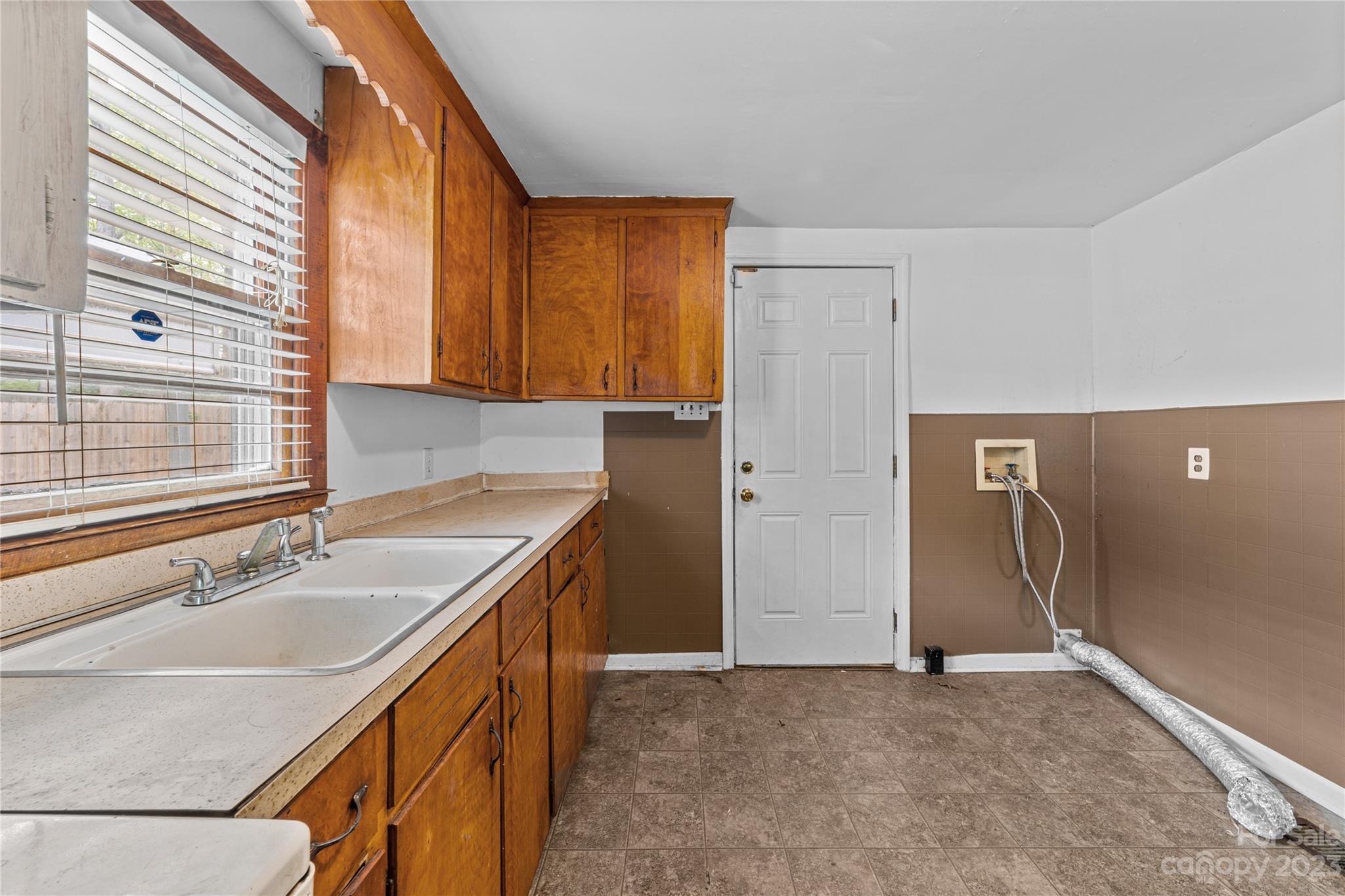 5641 Anderson Road Charlotte, NC 28269 - Photo 10 of 27 a bathroom with a sink and a mirror