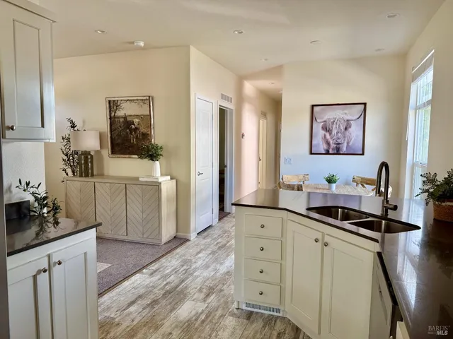 a kitchen with a sink stove and cabinets