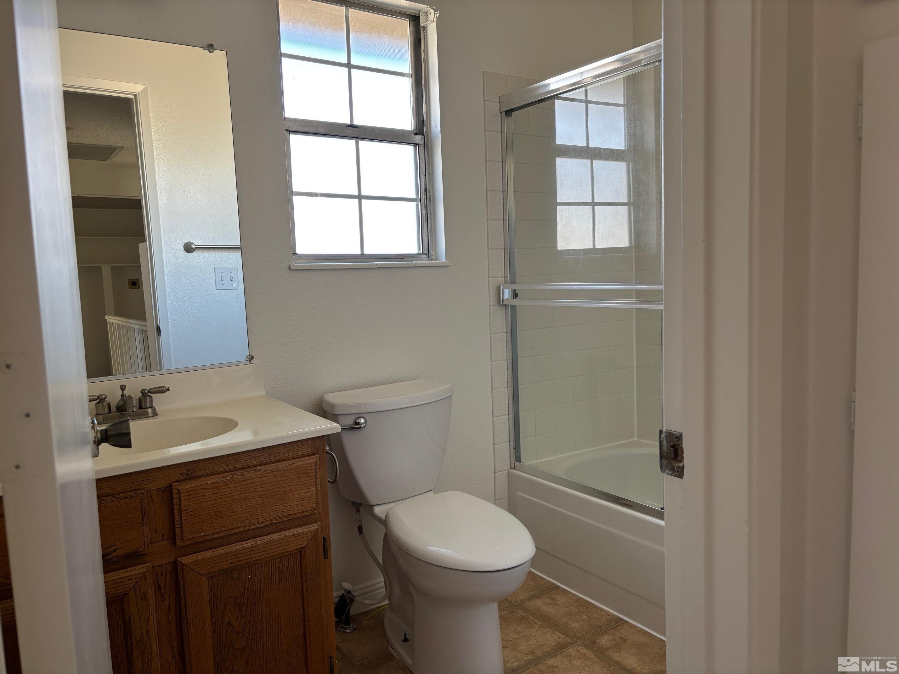 1721 Burnside Drive Sparks, NV 89434 - Photo 18 of 20 a bathroom with a sink toilet and shower