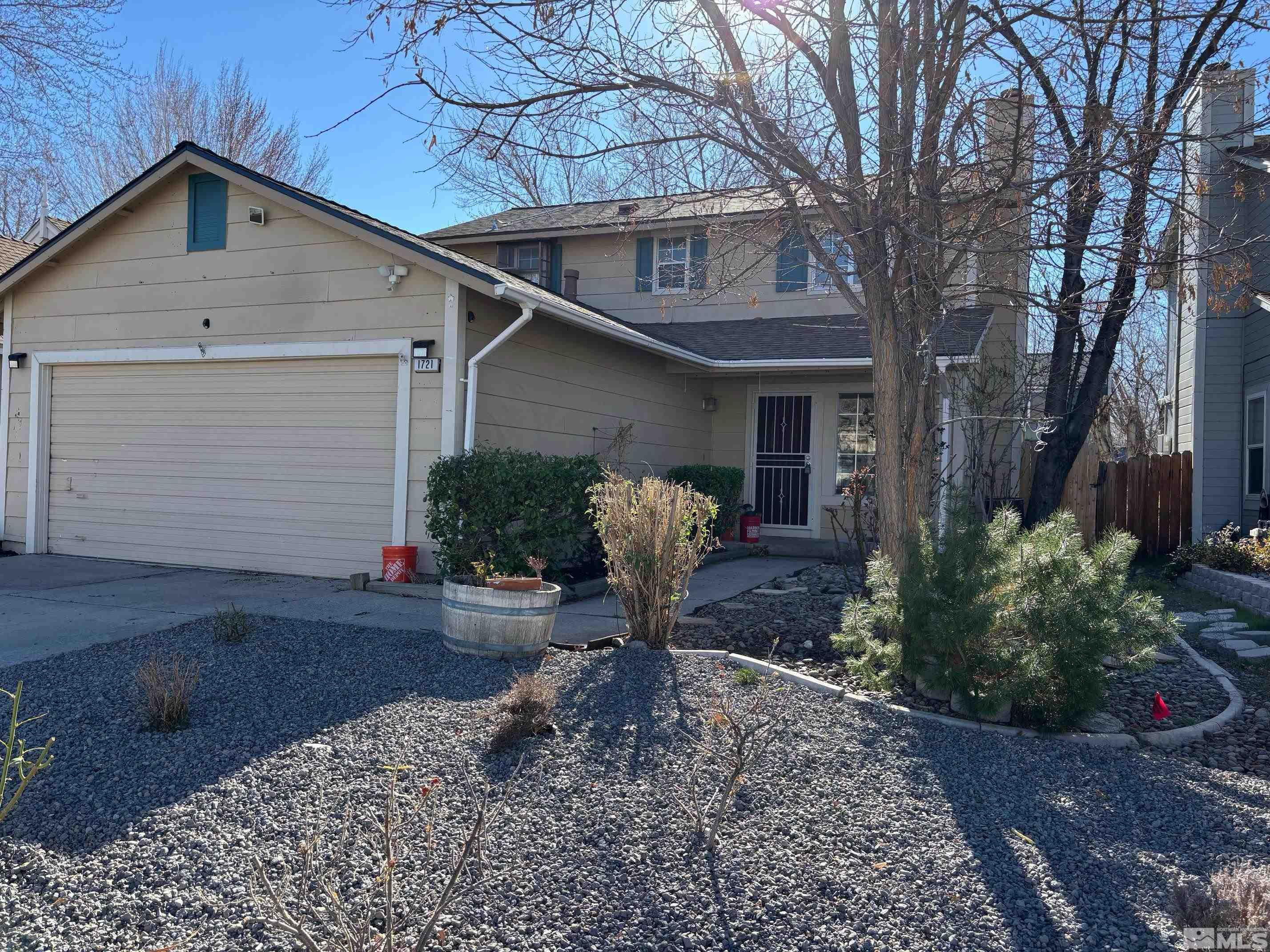 1721 Burnside Drive Sparks, NV 89434 - Photo 2 of 20 a front view of a house with garden
