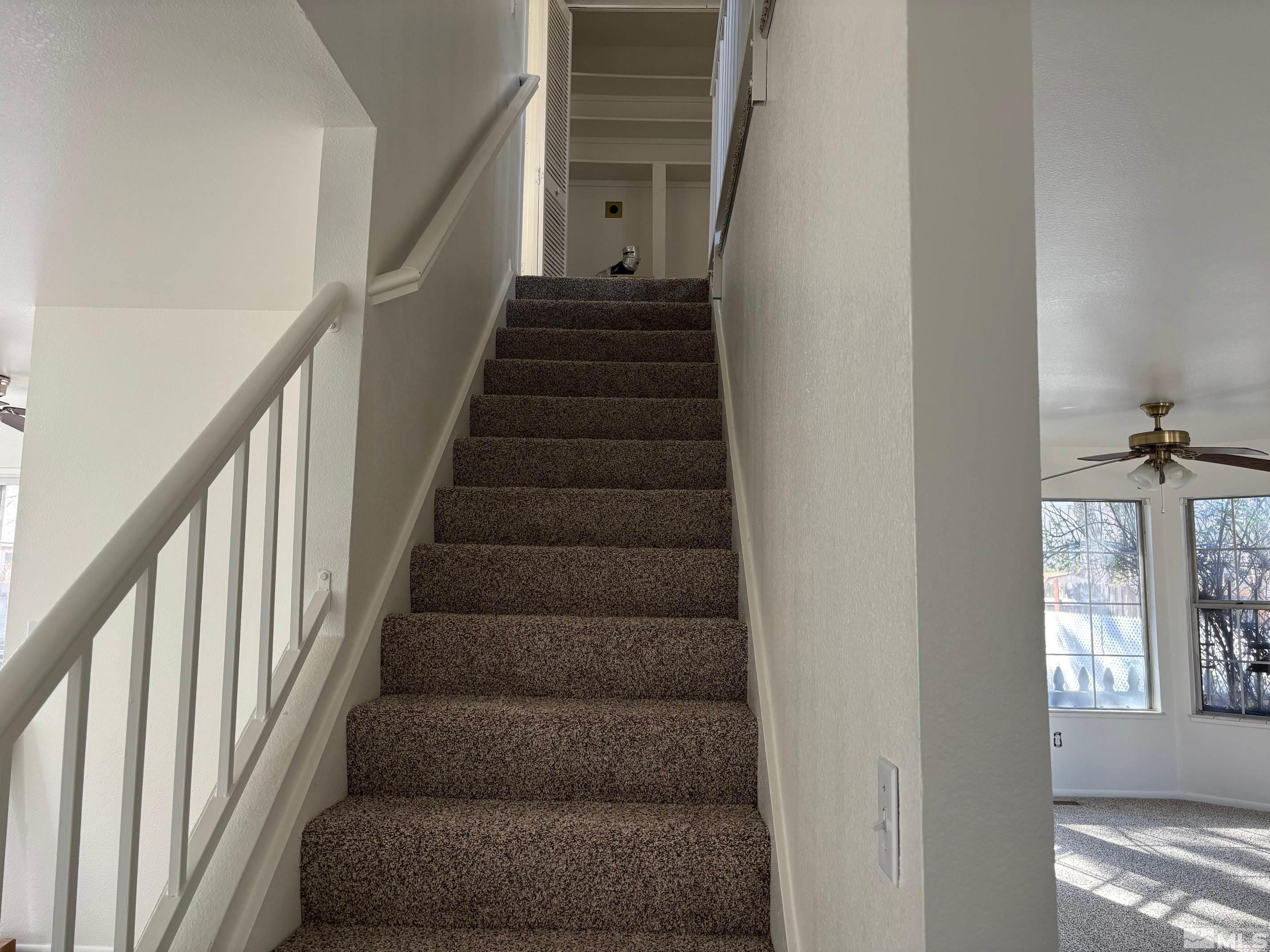 1721 Burnside Drive Sparks, NV 89434 - Photo 7 of 20 a view of staircase with white walls and windows