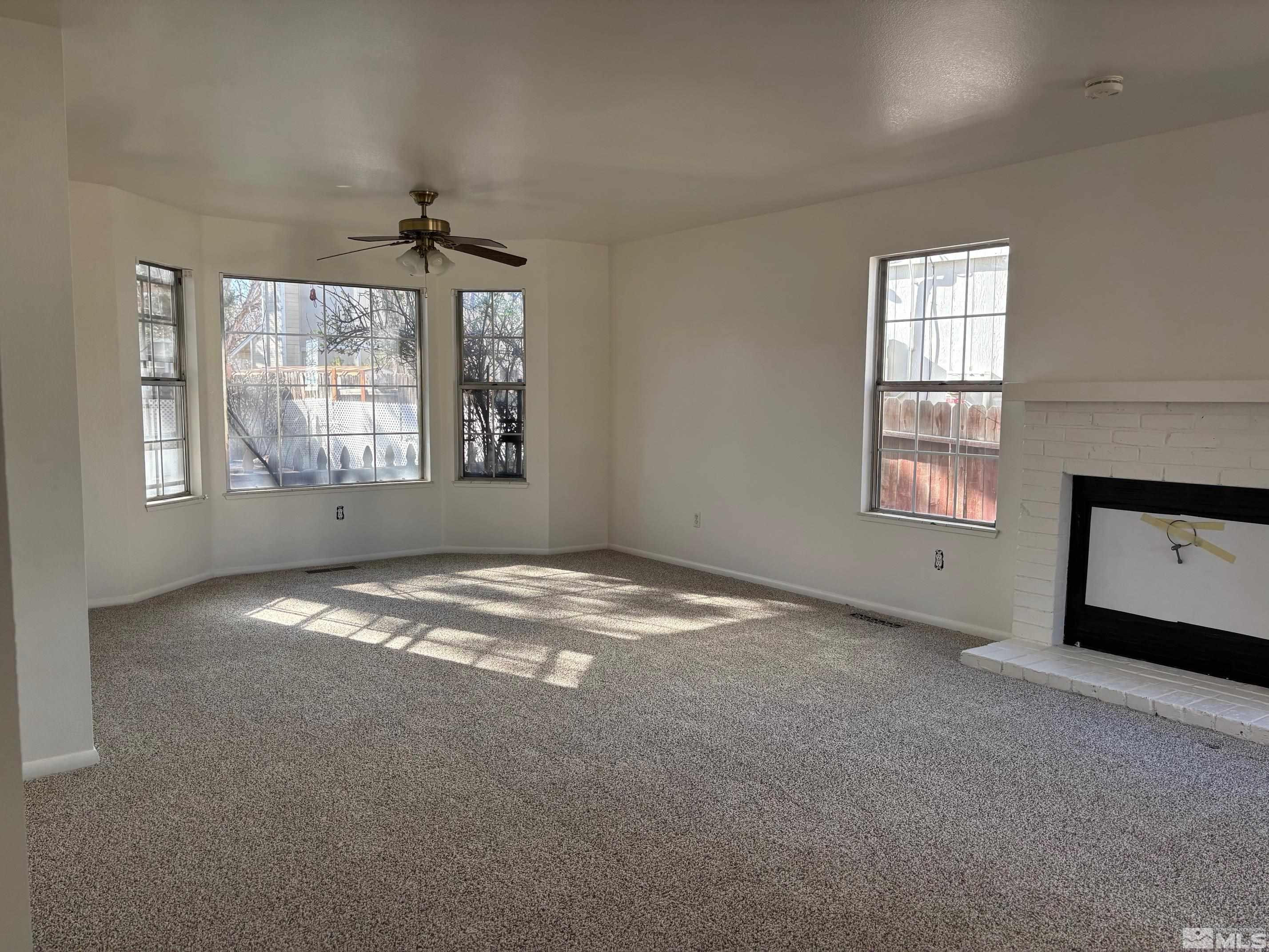 1721 Burnside Drive Sparks, NV 89434 - Photo 8 of 20 a view of empty room with windows