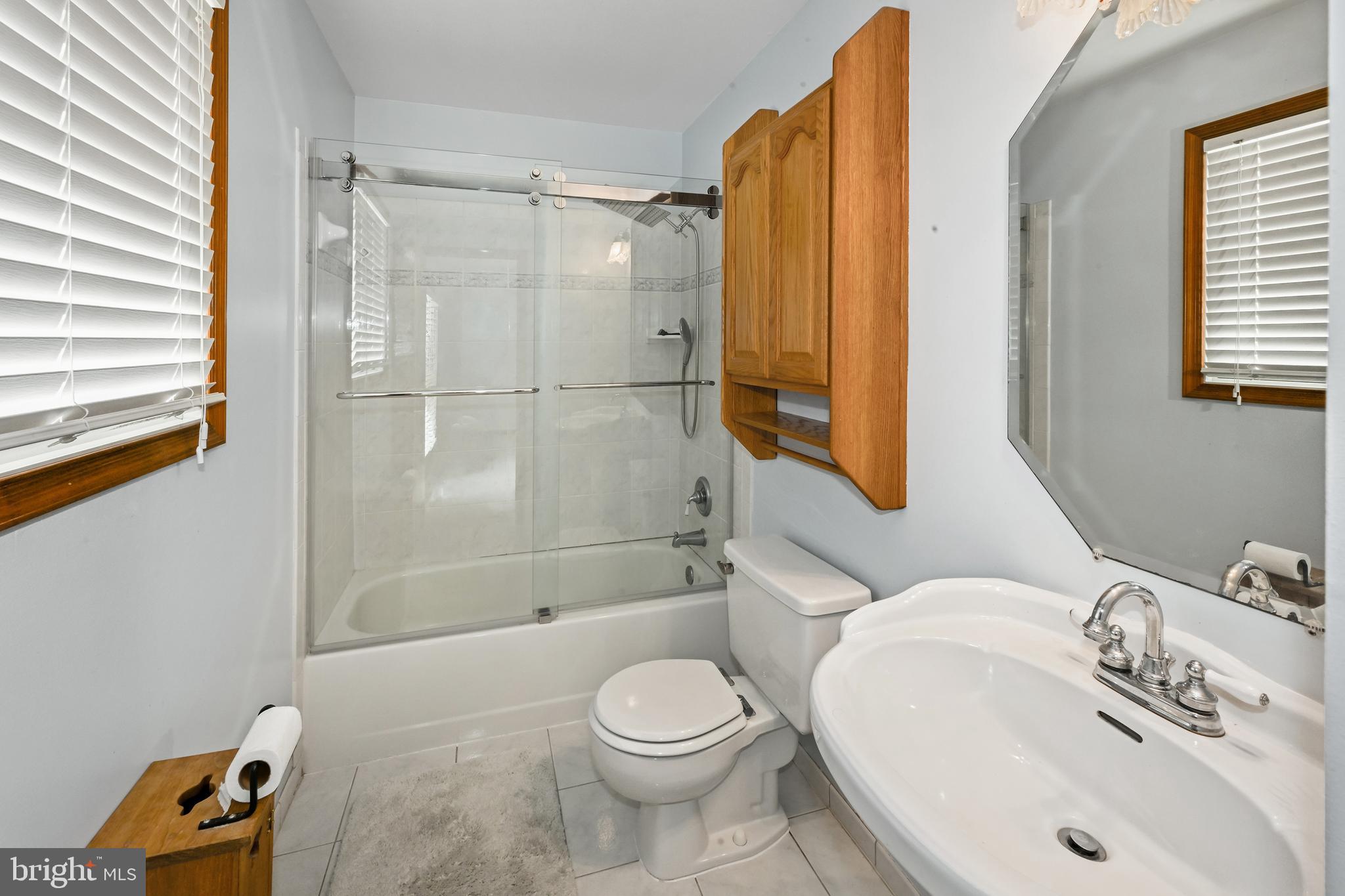 10303 Abbott Road Manassas, VA 20110 - Photo 19 of 36 a bathroom with a sink toilet and shower
