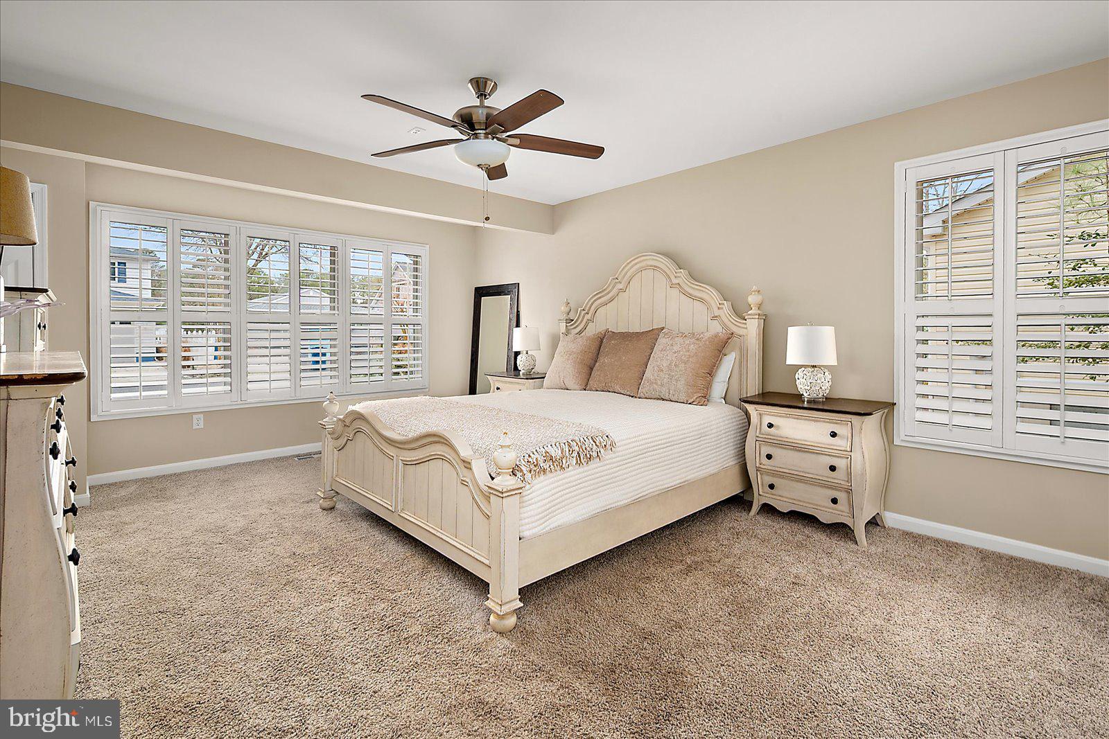 37 Watertown Road Ocean Pines, MD 21811 - Photo 20 of 86 a bedroom with a large bed and a large window