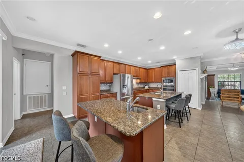 a kitchen with a table and chairs in it
