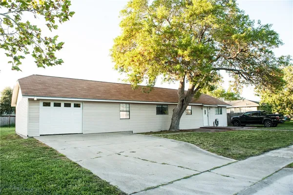 a house view with a backyard space