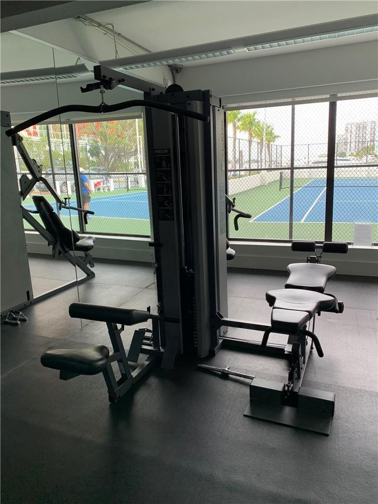 200 Southeast 15th Road, Unit 11H Miami, FL 33129 - Photo 15 of 35 a room with gym equipment and a large window