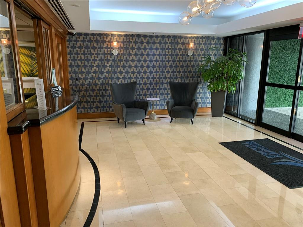 200 Southeast 15th Road, Unit 11H Miami, FL 33129 - Photo 17 of 35 a view of a patio with table and chairs