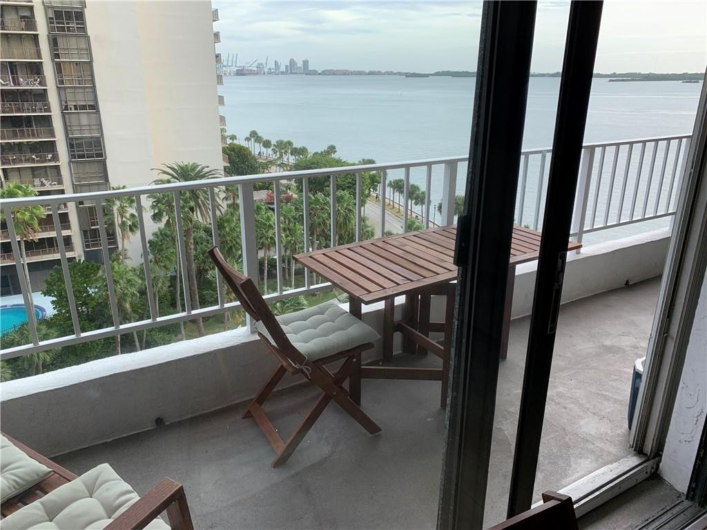 200 Southeast 15th Road, Unit 11H Miami, FL 33129 - Photo 20 of 35 a view of a balcony with furniture