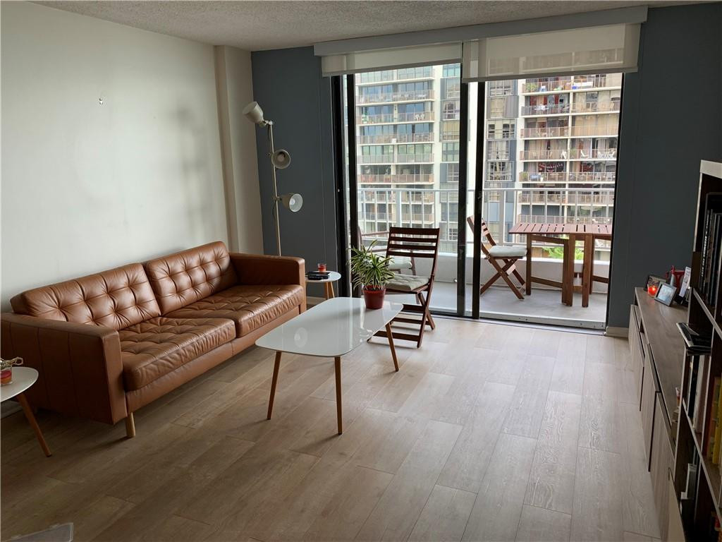 200 Southeast 15th Road, Unit 11H Miami, FL 33129 - Photo 21 of 35 a living room with furniture and a floor to ceiling window