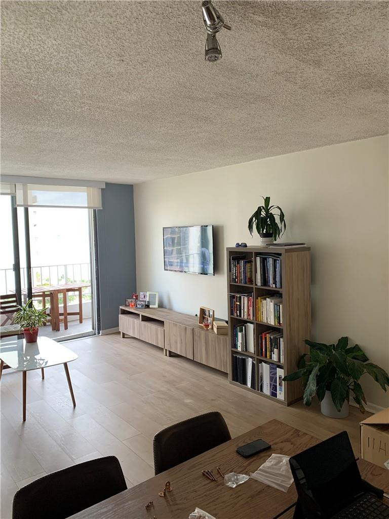 200 Southeast 15th Road, Unit 11H Miami, FL 33129 - Photo 22 of 35 a bedroom with furniture and a book shelf