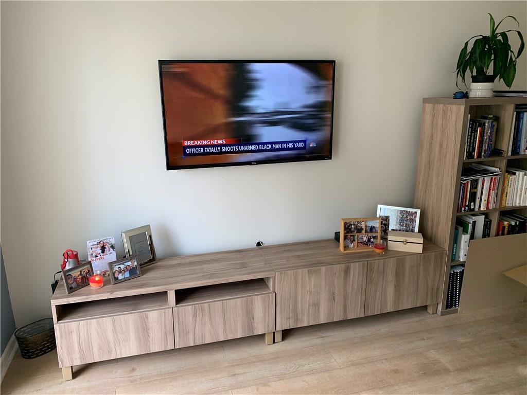 200 Southeast 15th Road, Unit 11H Miami, FL 33129 - Photo 23 of 35 a living room with furniture and a book shelf
