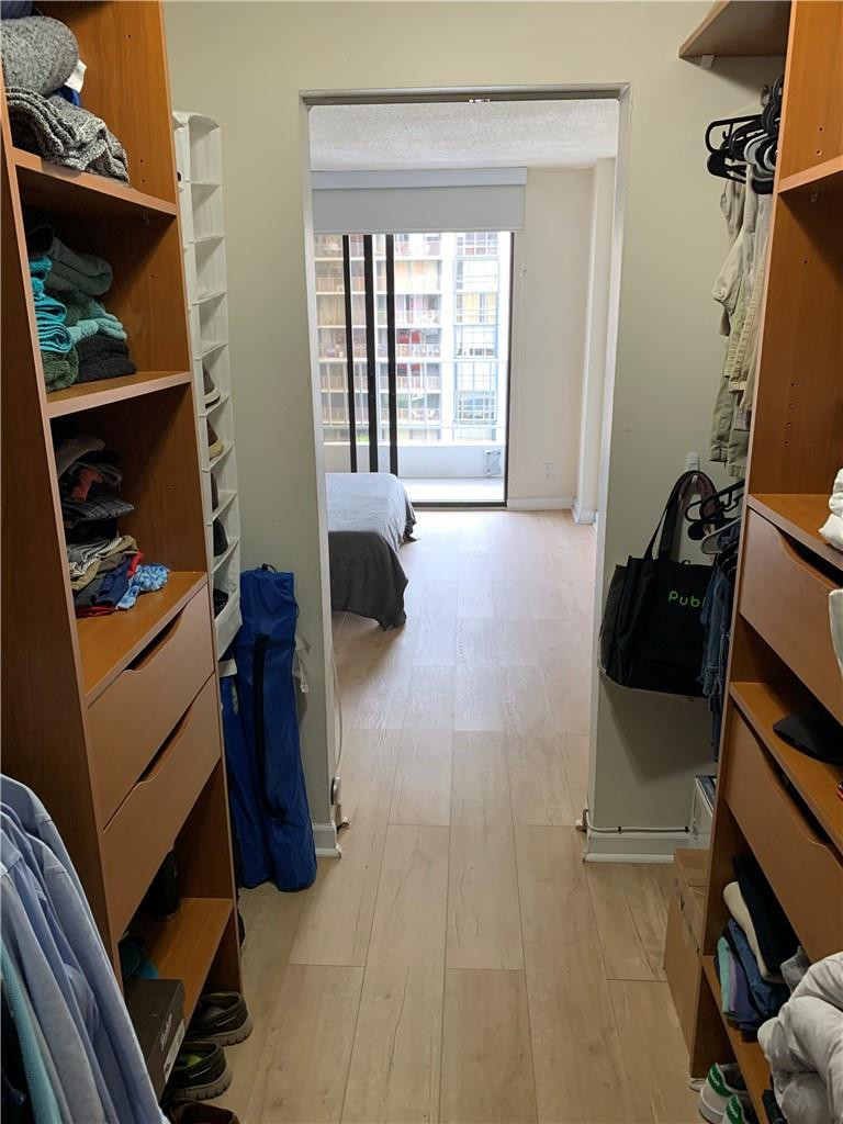 200 Southeast 15th Road, Unit 11H Miami, FL 33129 - Photo 29 of 35 a living room with furniture and a flat screen tv