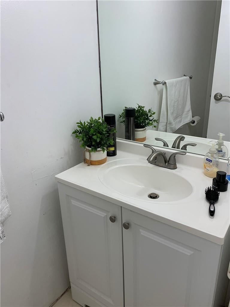 200 Southeast 15th Road, Unit 11H Miami, FL 33129 - Photo 32 of 35 a bathroom with a sink and a mirror