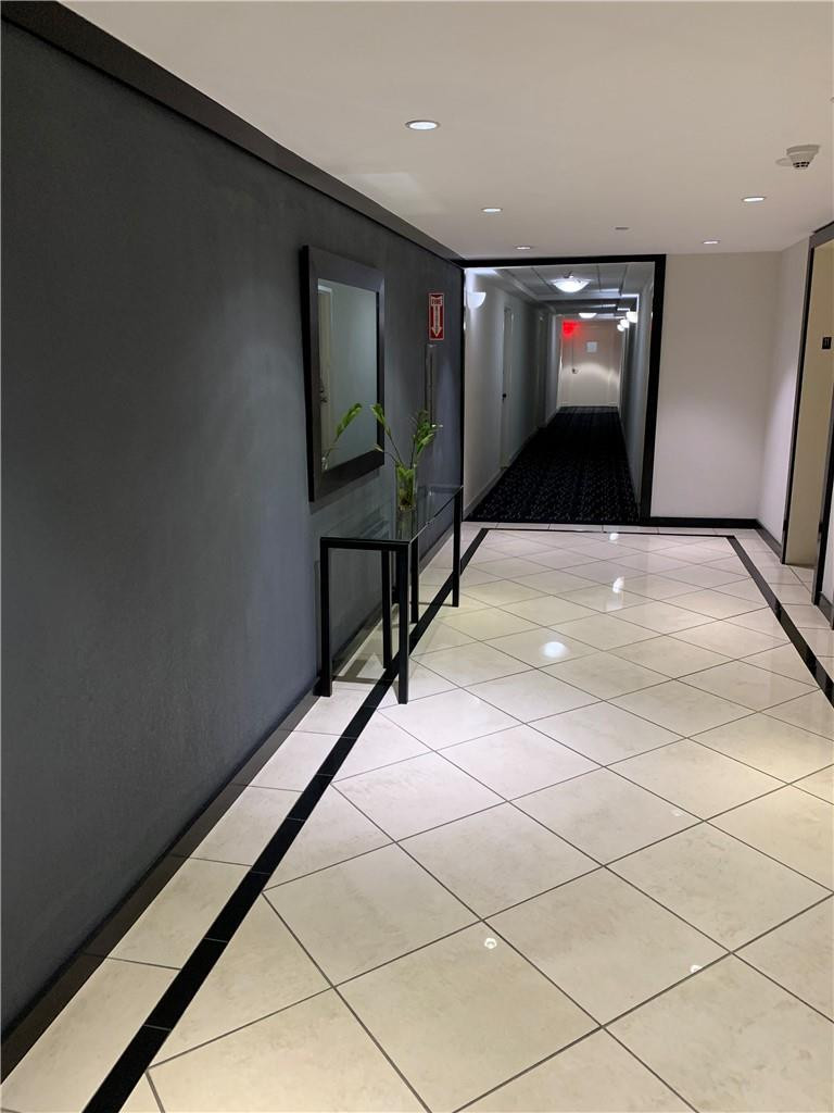 200 Southeast 15th Road, Unit 11H Miami, FL 33129 - Photo 35 of 35 a view of a hallway with wooden floor