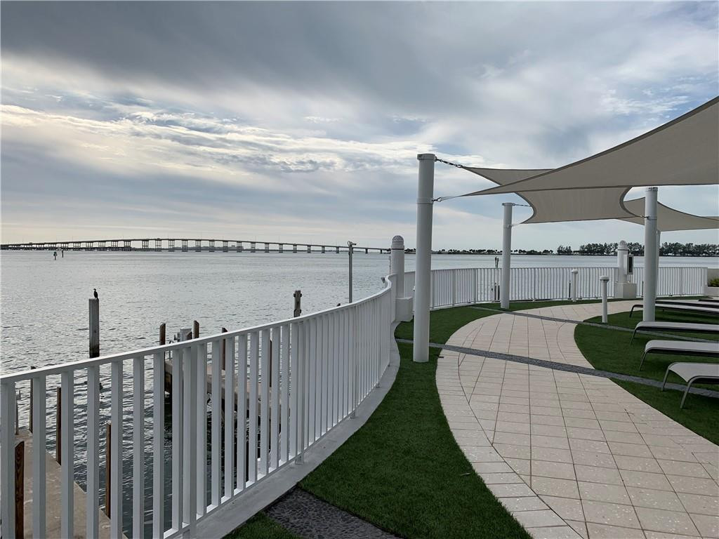 200 Southeast 15th Road, Unit 11H Miami, FL 33129 - Photo 4 of 35 a view of a balcony with wooden floor and fence